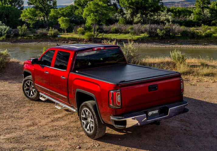 Red truck with a closed RetraxPRO MX retractable truck bed cover
