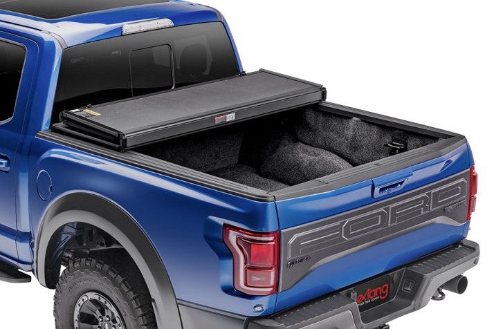Solid Fold 2.0 hard tri-fold truck bed cover on a blue truck