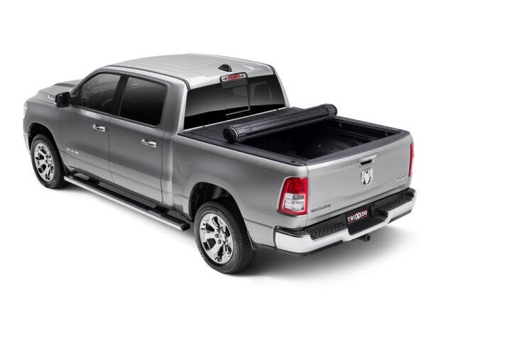 Sentry hard roll-up style truck bed cover on a silver truck